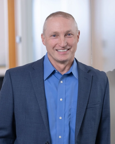 portrait of a smiling person in professional attire